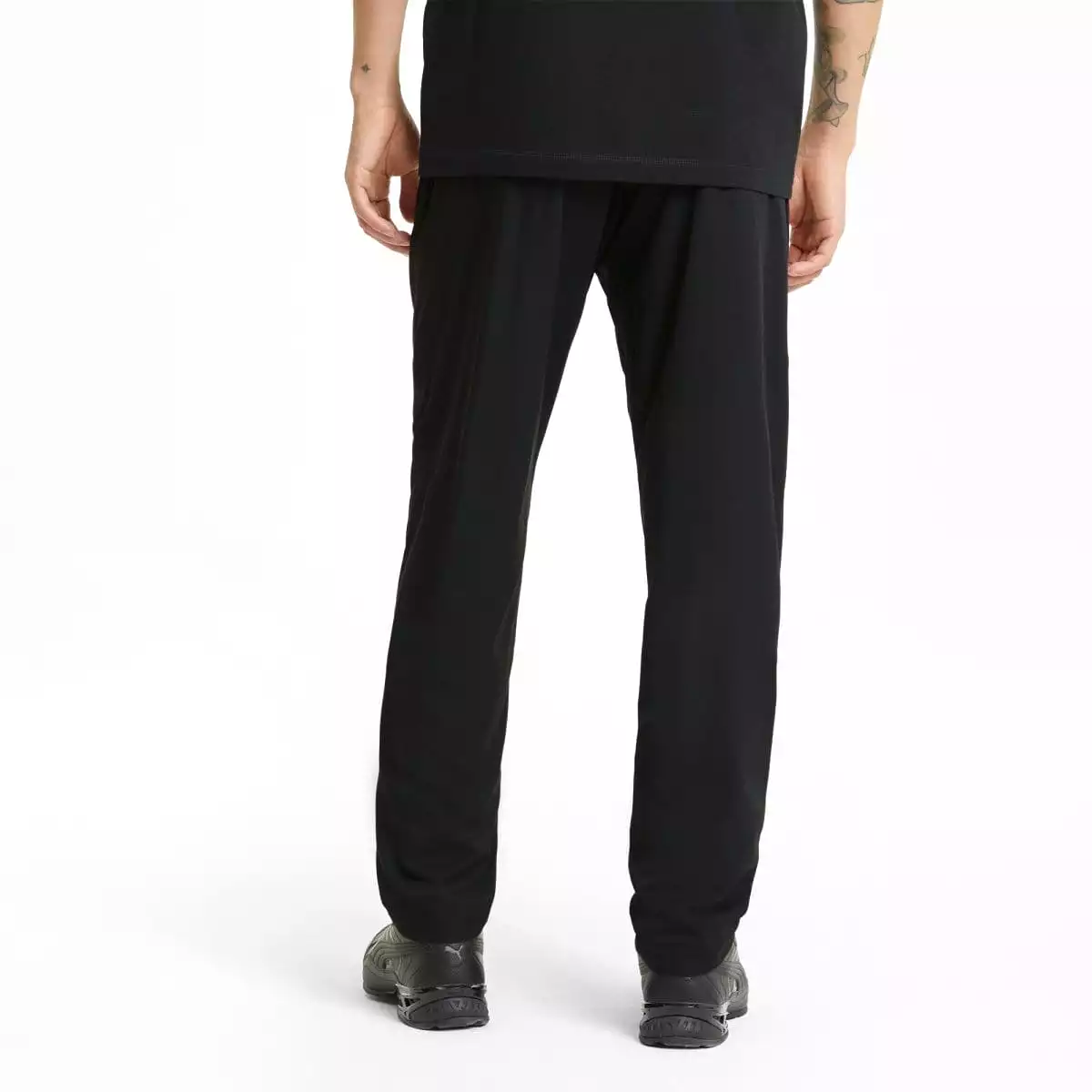 Puma black trackpants for men in an active woven style.