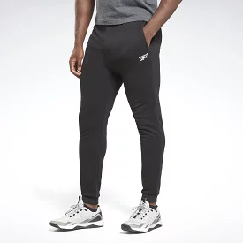 Reebok men's black trackpants with small vector design.