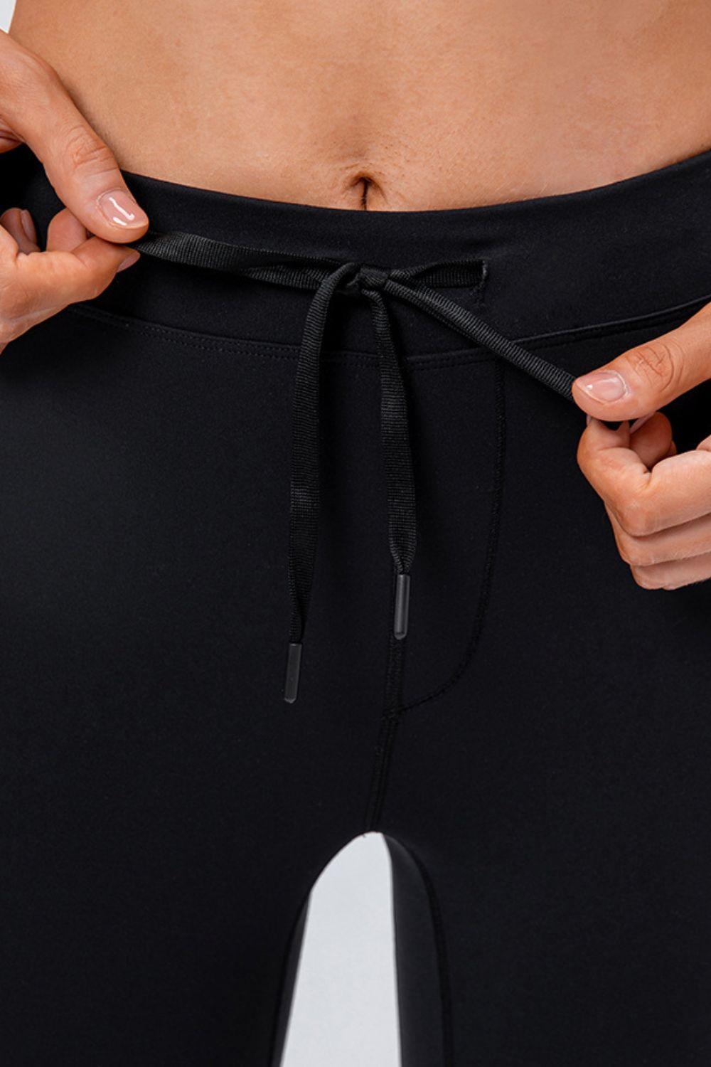 Sports Leggings with Drawstring and Side Pockets.