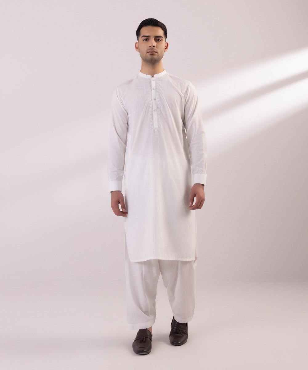 Wash and wear suit with embroidered design.