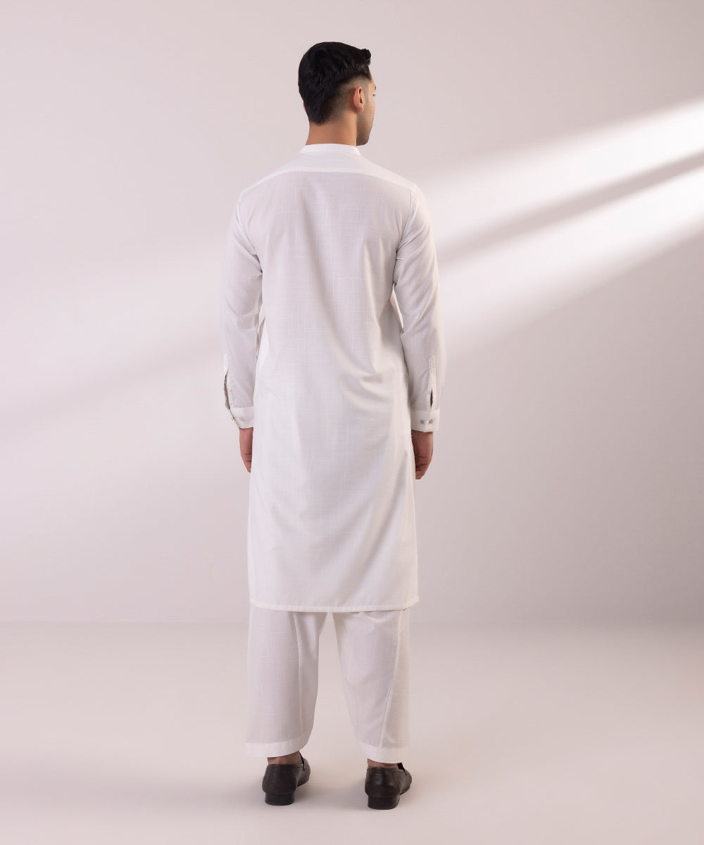 Wash and wear suit with embroidered design.